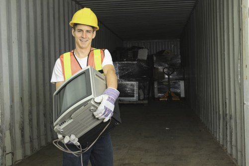 Workers clearing office waste from a Victorian terrace conversion